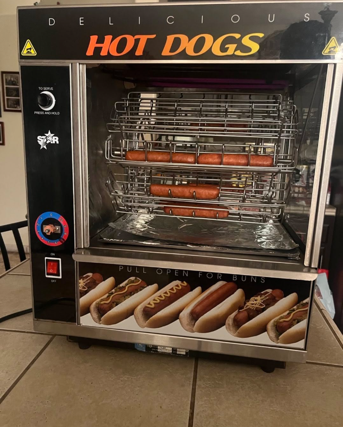 Hotdog roller machine